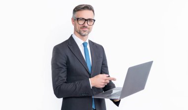 cheerful mature businessman working on laptop isolated on white background.