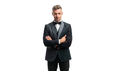 mature man in bow tie suit crossed hands. businessman isolated on white. leader in tux formal wear.