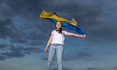 teen girl in ukraine. child with flag of ukraine. kid with ukraine flag feel free.