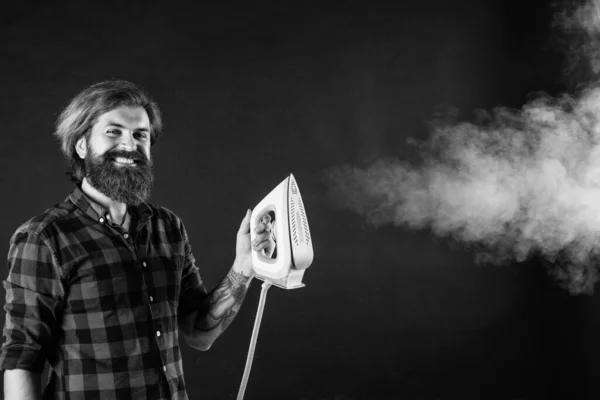 Make your choice. new technology. mature hipster with beard use steaming iron. brutal caucasian hipster with moustache ironing. male housekeeper. happy shop assistant in checkered shirt. bearded man.