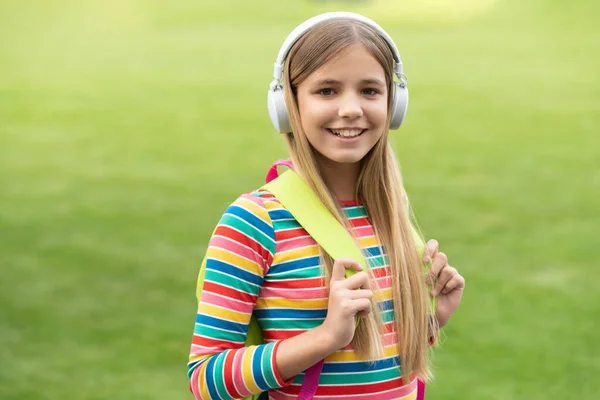 Happy Teenage Girl Headphones Back School Carrying Backpack Outdoors — Fotografia de Stock