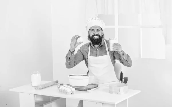 Eat better. male chef in hat prepare healthy meal. handsome man with beard and moustache cooking food. professional restaurant cook baking. skilled baker use kitchen utensils for cooking.
