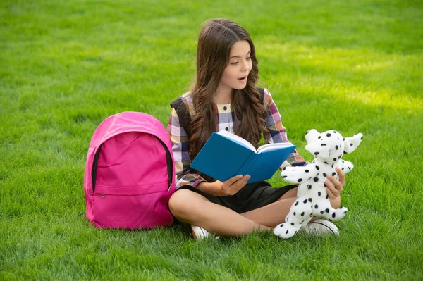 Teenage Girl Reading Book Dog Toy Sitting Grass School Back — 스톡 사진
