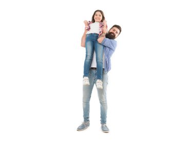 A darling daughter of her dad. Bearded man carrying small daughter child in his hands. Happy father and little daughter enjoying time together. Treating his daughter with love.