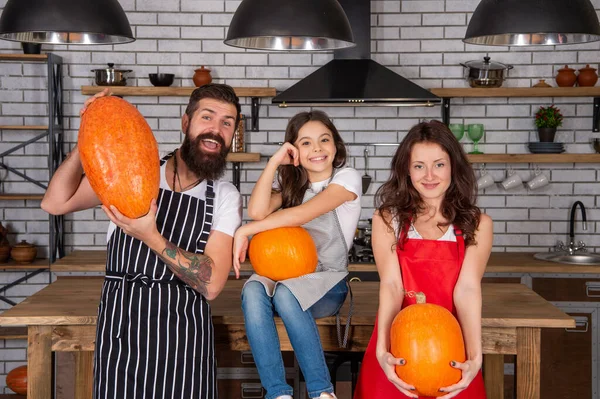 happy family cook halloween pumpkin together in kitchen, halloween.
