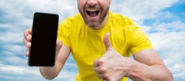 cropped view of guy presenting smartphone screen with copy space.