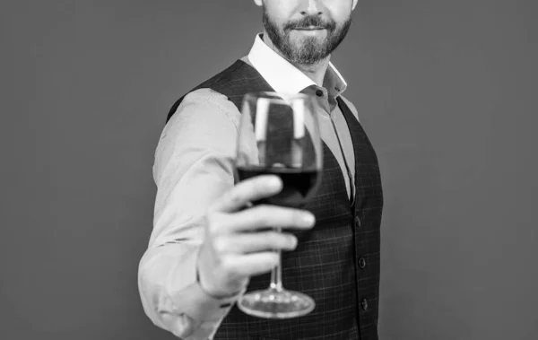 sommelier. guy drink red wine. cheers for happy valentines day. alcohol drinking. handsome male on romantic date. professional bartender. man with wine glass. skilled barman. selective focus.