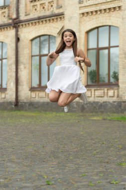 amazed funny teen girl. jumping girl having fun. teenager girl jump outdoor.