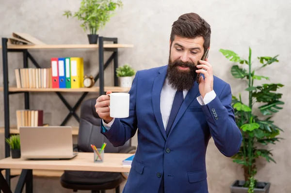 Business phone call. Businessman being on cellphone while drinking coffee. Making phone call. Mobile communication. Keep you sounding professional.