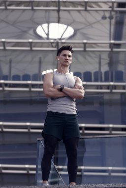 Spor eğitmenleri çevrimiçi. Mükemmel formda kasları olan güçlü bir atletik. Kulaklıkla müzik dinlerken egzersiz yapmak. Mola veriyorum. Tarz sahibi adam spor eğitimine hazır..