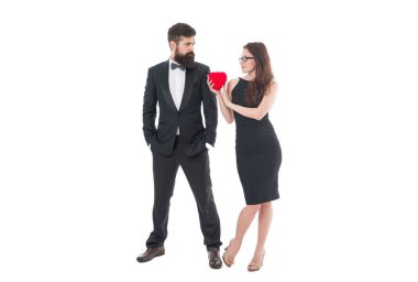 just married man and woman. valentines day. bearded man tuxedo and girl glasses. formal couple in love hold heart. engagement. elegant couple formal event. love and romance. special occasion.