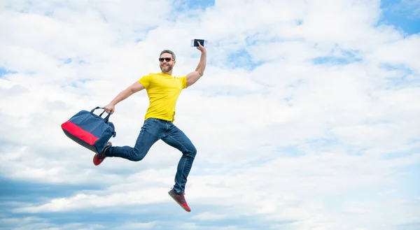 Active Man Jumping Travel Bag Midair Sky Background Copy Space — ストック写真