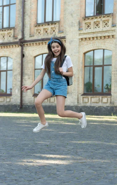 Happy Denim Girl Backpack Jumping Outdoor — Φωτογραφία Αρχείου