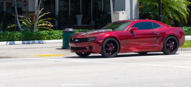 Miami Beach, Florida USA - April 15, 2021: red Chevrolet Camaro sportscar, corner view.