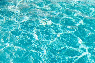 turquoise color background of swimming pool water with ripples in miami.