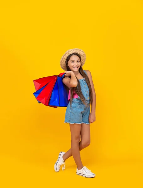 Cheerful Teen Kid Shopping Bags Yellow Background Full Length — Stock fotografie