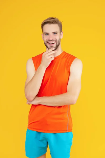 Happy Athlete Isolated Yellow Athletic Man Stroking Chin Studio Sporting — Foto Stock