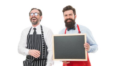 Everything is on schedule. cafe and restaurant opening. bearded men with blackboard, copy space. partners celebrate start up. menu planning. chef team in apron. catering business. welcome on board. clipart