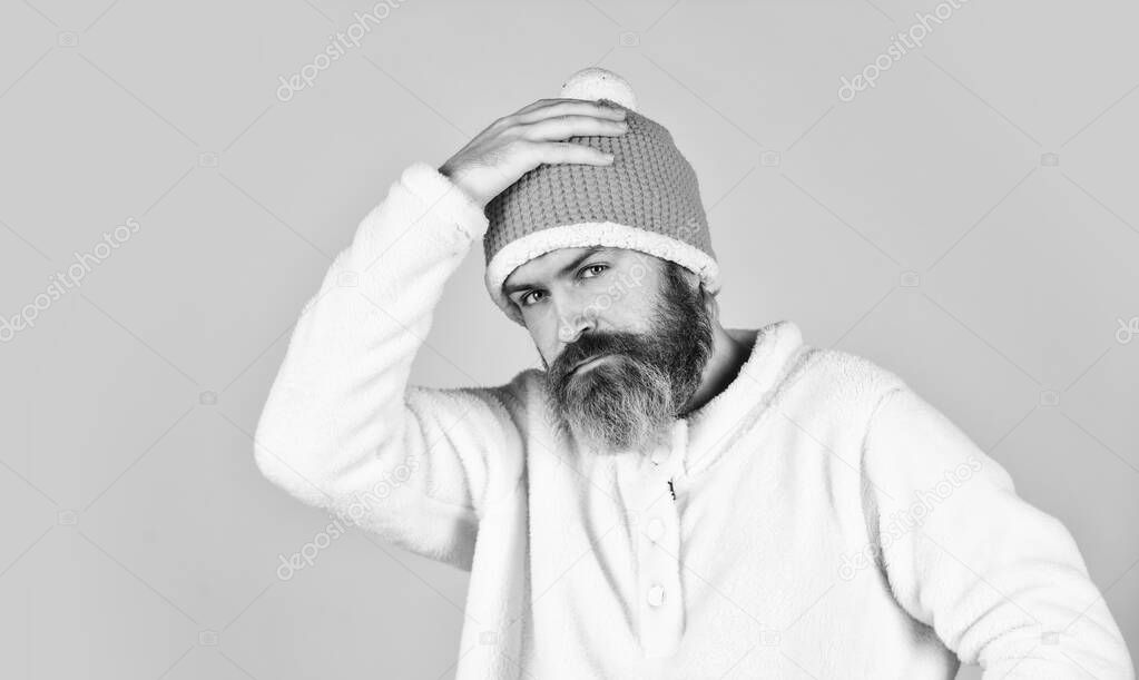 Ready for holiday. Handsome male model wearing warm hat. casual man in winter hat and warm clothes. happy hipster wear warm hat. cold and flu. Portrait of brutal man in fleece sweatshirt.