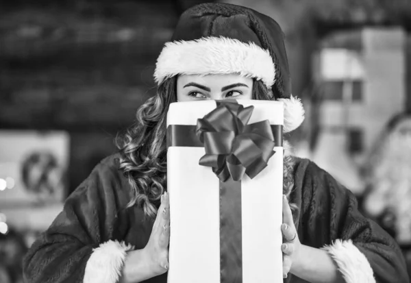 joy and cheer. girl santa among xmas gifts and presents box. black friday shopping. house christmas party. happy girl made cookies for santa. santa woman feel happiness in new year.