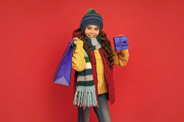 kid with package. happy birthday holiday. black friday discount. seasonal christmas sales. cheerful teen girl in with box. boxing day. present and gifts buy. shopping child smile with purchase.