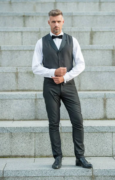 caucasian man in formalwear. formal fashion for man. elegant man wearing formal suit. full length.