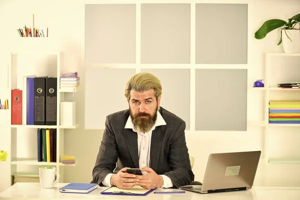 bearded man in jacket with laptop. boss in workplace. modern office life. distant work while coronavirus quarantine. mature school teacher. business-minded businessman.