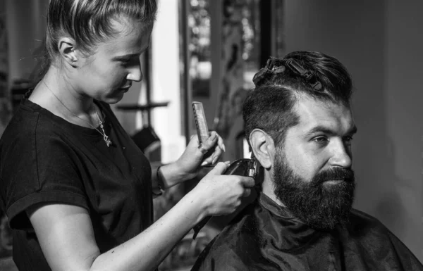 male trendy hairdo. perfect haircut with blade razor. barber master cut hair. mature hipster with beard at hairdresser. brutal hipster with moustache making new hairstyle. Clean and dry shaving.