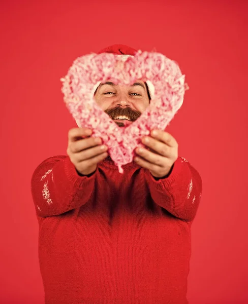 I love you. Cold Days. Warm Hearts. Welcome Christmas into your heart. Handsome man love winter holidays red background. Fall in love. Guy wear Santa hat. Merry christmas and happy new year.