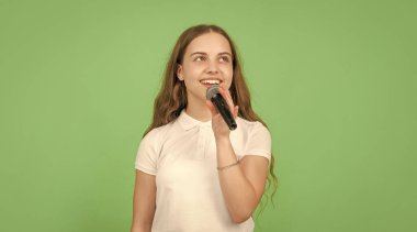 karaoke music. wireless audio accessory. childhood development. child singer sing in microphone. vocal education in musical school. happy teen girl singing in mic.