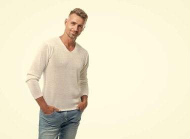 Angry guy shouting at alarm clock being in bed awake in morning, oversleeping.