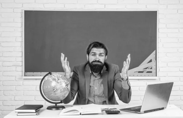 overworked man with beard having stress. troubles in studying. formal education. male student sit in school classroom while hard lesson. pass the exam. learning is hard. stressed hipster teacher.