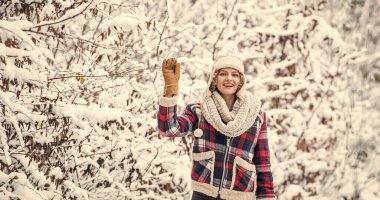 Favorite season. Walk in snowy forest. Happy girl having fun outdoors. Christmas time. Winter outfit. Woman wear warm accessories stand in snowy nature. Winter fashion collection. Winter admirer.
