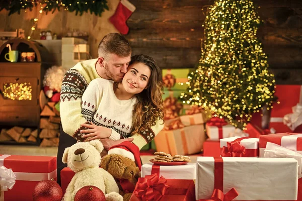 Christmas time. Family time. Positive emotions. Happiness and joy. Best holiday. Celebrate new year at home. Winter shopping sales. Happy woman and man. Holiday gift. Holiday mood. Couple in love.