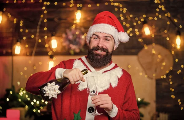 Man bearded santa celebrate christmas with alcohol drink. Celebrate with joy. Sparkling wine. Santa claus drinking champagne. New year celebration. Celebrate winter holidays. Indulge yourself in joy.