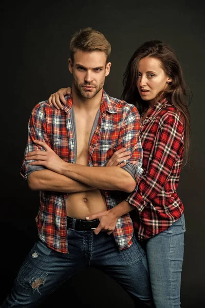 sexy man and woman embrace together in checkered shirt, relationship.