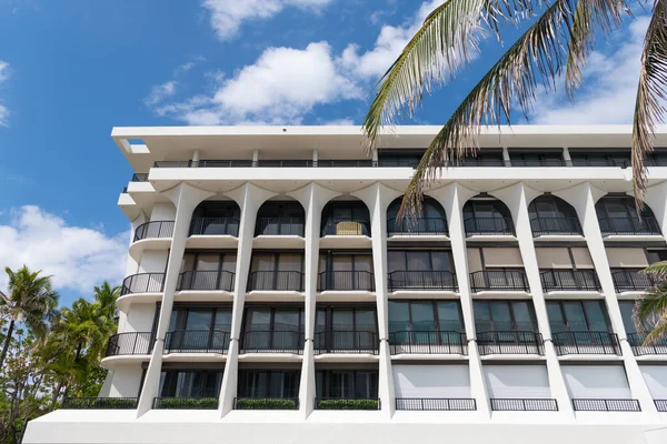 storey hotel building or residence with balconies on exterior.