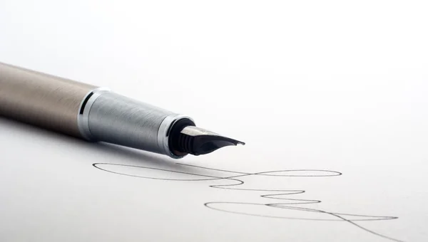 Pen on white paper — Stock Photo, Image