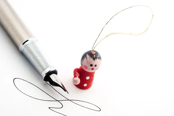 Pen with wooden guy — Stock Photo, Image