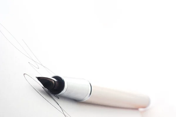 Pen on white paper — Stock Photo, Image