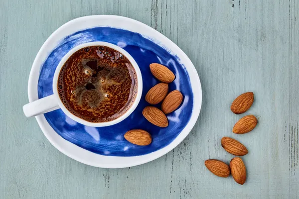 Cup Coffee Almonds Blue Wooden Table — Stock Photo, Image