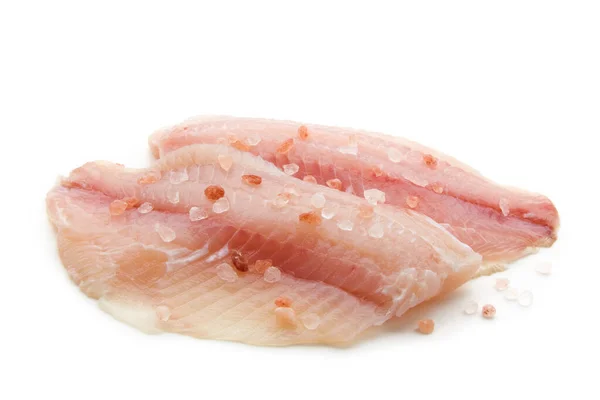 Prepared raw white fish fillet sprinkled with pink salt — Stock fotografie