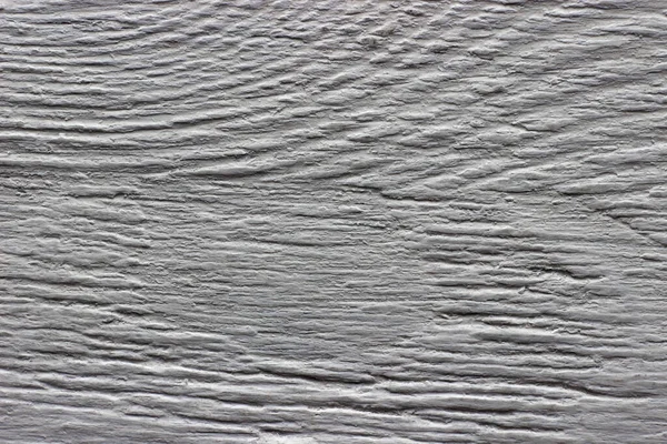 A textura da superfície de madeira pintada em close-up cinza — Fotografia de Stock