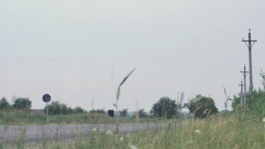 traffic on a bypass road behind a small Eastern European town