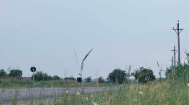  traffic on a bypass road behind a small town