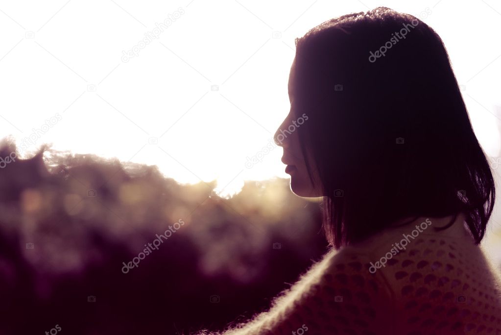Silhouette of lonely woman