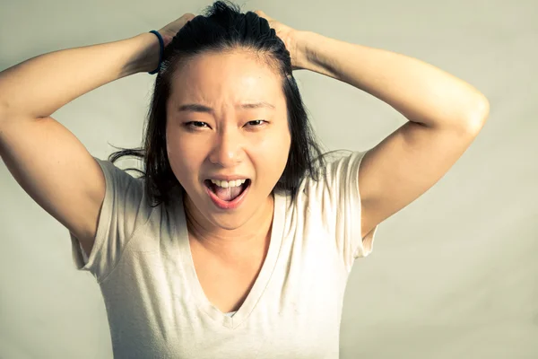 Woman pulling her hair — Stock Photo, Image