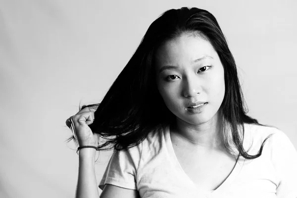 Young woman pulling her hair — Stock Photo, Image