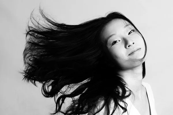 Woman flicking hair and posing — Stock Photo, Image