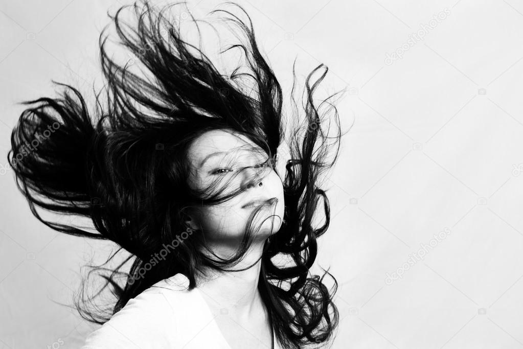 Young woman flicking hair